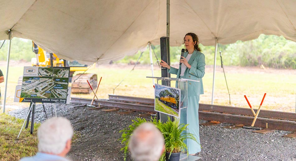 Kate Bourgeois, President and Chief Executive Officer of Mississippi Export Railroad, speaks at the Gold Spike Ceremony.