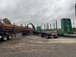 Pole transload onto flatcar